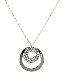 For style that's out of this universe -- try this chic, orbital pendant by Nine West! Two graduated circles shine in silver tone mixed metal and textured silver tone mixed metal. Approximate length: 18 inches. Approximate drop: 1-1/10 inches.