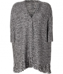 Cover up in ultra luxe style in Anna Suis fringed oversized knit cardigan - V-neckline, 3/4 dolman sleeves, ribbed trim, open front, fringed hemline - Easy draped fit - Layer over tissue tees with figure-hugging trousers and statement ankle boots