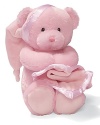 Key-wind musical bear gripping a blanket with a satin trim. Music plays Brahms Lullaby and the bear's head sways to music.