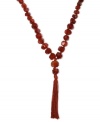 An on-trend tassel. Lucky Brand's strand necklace, crafted from silver tone mixed metal, is adorned with semi-precious carnelian accents to give it more body. Approximate length: 25 inches + 2-inch extender. Approximate drop: 5-1/2 inches.