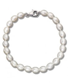 As necessary as a little black dress. This simple sterling silver bracelet features oblong cultured freshwater pearls (6-7 mm). Approximate length: 8 inches.