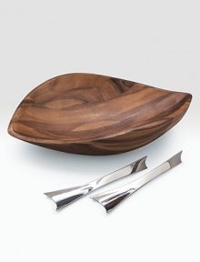 An artisan bowl is handcrafted of dense, durable acacia with a finely patterned grain and modern, sloping lines. Unique servers made of stainless steel define this beautiful serving set. 19W X 5H X 12½D Hand wash Imported