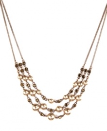 Mocha glass pearls and smokey quartz-colored crystals are intricately intertwined in this elegant necklace from Givenchy. Crafted in brown gold tone mixed metal. Approximate length: 16 inches + 2-inch extender.