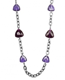 Colorful and chic. Rich jewel tones of amethyst and garnet decorate this distinctive long necklace from AK Anne Klein. Crafted in hematite tone mixed metal, it features acrylic accents. Approximate length: 36 inches.