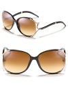 Round oversized sunglasses with metal snake detail that twists and turns along temples for a unique style.