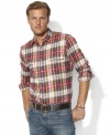 A relaxed-fitting button-down is woven from soft cotton and accented with patch pockets and a timeless plaid pattern.