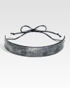 An oxidized finish lends a rustic look to this bold metal belt. Oxidized metal Cotton cord tie closure About 1 wide Imported 