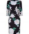 Power florals remain in full bloom, and Leonards black and white orchid print silk dress elevates the trend to new levels of ladylike luxe - Slim cut, with a waist cinching tie belt - Gently belled 3/4 sleeves and flattering boatneck - Pencil-style skirt hits at knee - Pair with ballet flats and a light cardigan by day, and style with a cropped leather jacket and strappy sandals by night