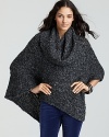 Luxuriously cozy, this Ella Moss cowlneck poncho touts a cable-knit pattern for a smart accent.