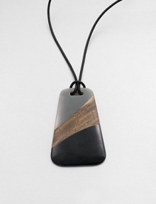 A leather cord and stunning, art-deco inspired pendant made from a brilliant combination of wood and resin.Leather cordLength, about 23Pendant size, about 4Pull-stringImported