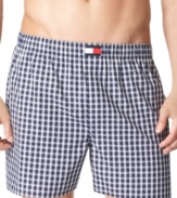 A four-pack wardrobe of cotton boxer shorts-in a palette true to the red, white, and blue-from Tommy Hilfiger.