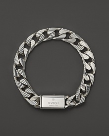 Bold trademark stripes add textural beauty to this sterling silver link bracelet from Gucci.