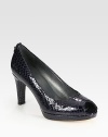 Patent leather in a primal snake print with a chunky heel and platform. Self-covered heel, 3 (75mm)Covered platform, ½ (15mm)Compares to a 2½ heel (65mm)Snake-print patent leather upperLeather lining and solePadded insoleImported