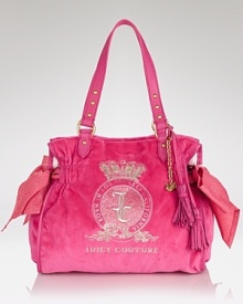 Make any outfit fashion-forward by adding this velour satchel from Juicy Couture. Sized to meet daily demands, this bag is a dreamy option for carting extracurricular essentials.