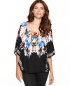 Bold ikat print give way to chic black on Style&co.'s kimono-sleeve poncho top!