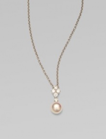 Five dazzling diamonds accent this round Akoya pearl pendant on a sleek 18k white gold link chain. 8MM white, round, Akoya pearlDiamonds, .35 tcwLength, about 18Pendant size, about 1¾ Lobster clasp closureImported 