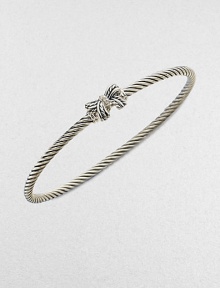 A charming, sterling silver cable design with a pretty diamond accented bow. Sterling silverDiamonds, .02 tcwDiameter, about 2½Slip-on styleImported 