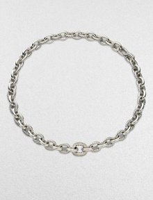 From the Chain Collection. A simply chic style featuring alternating smooth and cable links with a brilliant center link encrusted in diamonds. Sterling silverDiamonds, .81 tcwLength, about 17Push clasp closureImported 