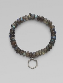 This labradorite beaded, stretch design is accented with a diamond embellished rhodium hexagon charm for a sleek look. Labradorite beadsRhodiumDiamonds, .16 tcwLength, about 6¾Elastic slip-on styleMade in USA of imported materials