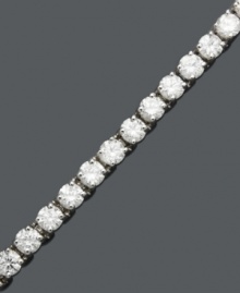 Diamond decadence. She will love you forever when she opens this gift. Tennis bracelet features a sparkling row of round-cut diamond (8 ct. t.w.) crafted in 14k white gold. Approximate length: 7 inches.