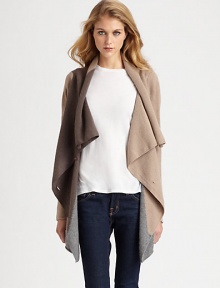 Neutral, lightweight and draped, this lengthy cashmere sweater is an essential piece for every season. Draped button frontLong sleevesAsymmetrical cropped back hemAbout 33 from shoulder to hem at longest pointCashmereDry cleanImportedModel shown is 5'11 (178cm) wearing US size Small.