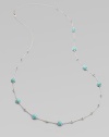 Mini ball accented sterling silver link chain with rich, faceted turquoise stone stations. TurquoiseSterling silverLength, about 38Lobster clasp closureImported 