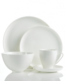 Echoing the feel of hand-thrown pottery, the contemporary Spin 5-piece place settings from Sasaki's collection of white dinnerware boasts a subtle spun etching, giving each piece its distinctive character.