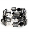 What's the square root of chic? Haskell! This geometrically glam style features three rows of faceted square and round beads in black, clear, and black pinstripe. Set in silver tone mixed metal. Bracelet stretches to fit wrist. Approximate diameter: 2-1/2 inches.