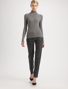 Ultra-soft finespun wool, in a rib-knit turtleneck style.TurtleneckLong sleevesMerino woolDry cleanImported of Italian fabricModel shown is 5'10 (177cm) wearing US size Small. 