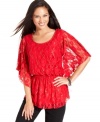 Floral lace and flutter sleeves are just two of the reasons Style&co.'s smocked lace top looks extra feminine.