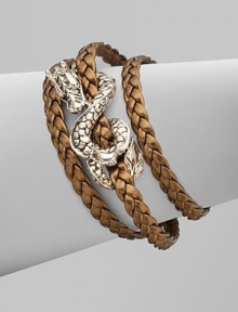 From the Naga Collection. A braid of rich leather wraps the wrist three times while weaving in and out of a curvaceous silver dragon.LeatherSterling silverLength, about 6½Lobster claspMade in Bali