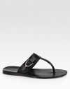 Leather thong sandal with silver palladium hardware.Stirrup detailLeather soleMade in Italy