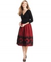 SL Fashions crafts a petite party dress featuring a flattering ruched waistline and a full, floral-embellished skirt.