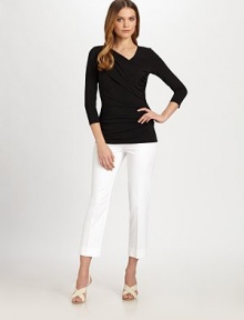 A unique design featuring a feminine neckline and asymmetrical details for a flattering effect. V-necklineLong sleevesAsymmetrical gathered detailsPull-on styleAbout 26 from shoulder to hem91% viscose/9% spandexHand washImported Model shown is 5'10 (177cm) wearing US size Small. 