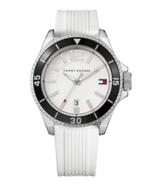 A classic sport watch by Tommy Hilfiger, perfect for the field, court or green. White rubber strap and round silvertone mixed metal case. Rotating black bezel with white numerals and stick indices. White dial features silvertone stick indices, luminous hands, numeral at twelve o'clock, iconic flag logo at three o'clock and date window at six o'clock. Quartz movement. Water resistant to 30 meters. Ten-year limited warranty.