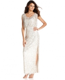 Top-to-bottom sequins give a luxe look to this blouson-style gown from JS Collections.