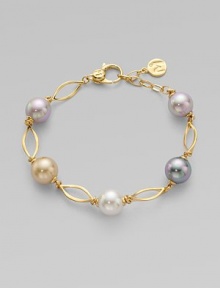 A gorgeous blend of different colored pearls with 18k goldplated sterling silver links. 10mm and 12mm round white, champagne, grey and black organic hand-made pearls 18k goldplated sterling silver Lobster clasp closure Length, about 7½ Imported 