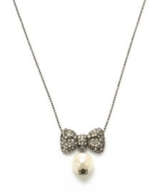 Sparkling and stylish. Betsey Johnson's bow and glass pearl pendant necklace will add plenty of panache to your look. Crafted in hematite tone mixed metal, it's adorned with dazzling crystal details. Approximate length: 16 inches + 3-inch extender. Approximate drop: 1 inch.