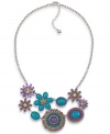 Infuse your look with freshness! Carolee's breezy style features two rows of bright blue and purple plastic beads in floral patterns. Set in silver tone mixed metal. Approximate length: 18 inches + 2-inch extender. Approximate drop: 3 inches.