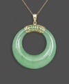 Calm, cool, and collected. This serene pendant features cut-out jade (30 mm) highlighted by a Greek key setting crafted from 14k gold. Approximate length: 18 inches. Approximate drop: 1-1/2 inches.