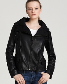 A speckled wool blend lining lends a unique touch to Andrew Marc's burnished leather jacket, edgy in an asymmetric silhouette and decorative zip trim for downtown-cool.