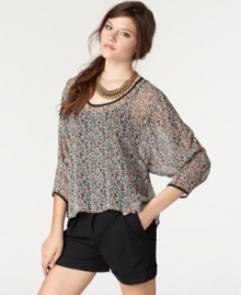 Back keyhole cutouts & an asymmetrical hi-lo hem ups the edge on this sheer floral-printed Bar III top -- a hot layering piece!