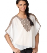 With an embroidered bib front and trendy poncho silhouette, this Bar III blouse is the perfect top for any pair of jeans.