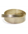 Lock in fabulous style with Jones New York's interlocked bangle. Bracelet crafted from two bands of gold-plated mixed metal. Approximate diameter: 2-3/4 inches.