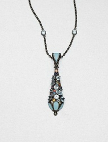 A colorful pendant encrusted with faceted multi-colored sapphires and blue topaz stones accented with bright enamel on a blue topaz station necklace on a rhodium-plated sterling silver link chain. Blue topazMulti-colored sapphiresEnamelRhodium-plated sterling silverLength, about 16Pendant size, about 2Lobster claspImported 