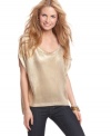 Liven up your jeans with a shot of metallic glam via this oversized sweater from Jessica Simpson!