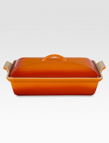 Crafted from heavy stoneware, Le Creuset cookware is the ultimate ingredient for chefs and home cooks worldwide. With its secure lid, this covered casserole is a convenient choice for transporting dishes to parties and picnics. Not only does the lid provide an effective moisture and heat lock for the dish, but it prevents spills and protects its contents.