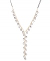 Long and luxurious. Kenneth Cole New York's subtly shimmering y-shaped necklace features faceted glass beads and crystal-encrusted discs in hematite hues. Chain crafted from gold tone mixed metal. Approximate length: 27 inches + 3-inch extender. Approximate drop: 7-1/2 inches.