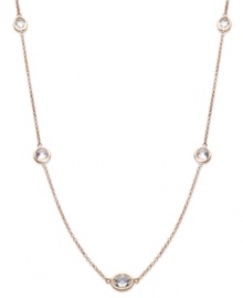 Layer yourself with inches of sparkle. This delicate necklace is crafted in 14k rose gold over sterling silver, with round-cut white topaz stations (9 ct. t.w.). Approximate length: 36 inches.