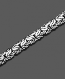 A 14k white gold bracelet with smooth, sensuous style. Approximate length: 8 inches.